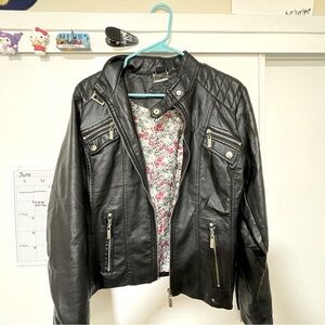 Black leather jacket with an inner lining made by the brand joujou